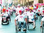 Un grupo de discapacidados durante una carrera popular.(ARCHIVO)