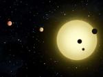 Recreaci&oacute;n art&iacute;stica de unos seis peque&ntilde;os planetas que orbitan alrededor de una estrella similar al Sol.