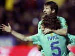 Leo Messi celebra un gol del Bar&ccedil;a junto a Carles Puyol.
