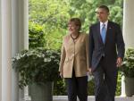 El presidente estadounidense Barack Obama y la canciller alemana Angela Merkel a su llegada a la rueda de prensa tras su encuentro celebrado en la Casa Blanca.