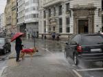 A Coru&ntilde;a Temporal de lluvia y viento Un coche salpica a un hombre con su perro en el Obelisco 20/01/2021 Foto: M. Dylan / Europa Press