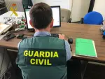 Guardia Civil en un ordenador.