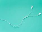 Earphones for Smartphone Isolated on Turquoise Background Top Vie