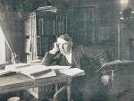 Thomas Edison en su biblioteca, sentado en una mesa llena de libros.