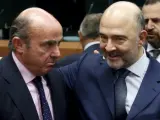 Luis de Guindos y Pierre Moscovici