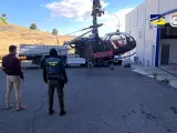 Agentes de la Guardia Civil y OFAST incautan un helicóptero durante la operación 'COPA-SUCRE'.