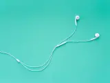 Earphones for Smartphone Isolated on Turquoise Background Top Vie