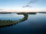 Beautiful ridge road between lakes in Saimaa in summer in Finland