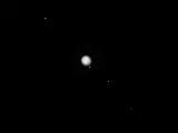 Imagen de Júpiter junto a sus cuatro lunas mayores.
