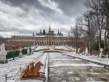 Snowy public gardens, historic fountains and exterior of the Baroque Palace of La Granja de San Ildefonso, Segovia, Castilla y Leon, Spain