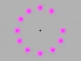Ilusión óptica de puntos rosas.