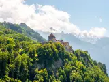 Vaduz, Liechtenstein - July 01, 2016: Landscape view on the mountains with Vaduz castle in the capital of Liechtenstein.