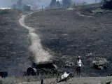 Vista de las zonas quemadas tras un incendio forestal declarado cerca de la ciudad de Volos el 27 de julio de 2023. Debido a un incendio declarado cerca de la ciudad de Volos, la zona industrial y algunos asentamientos fueron evacuados.