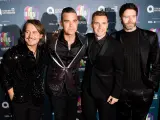 Mark Owen, Robbie Williams, Gary Barlow y Howard Donald, excomponentes de Take That en una gala benéfica.