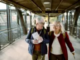 Close up of two seniors at a train station
