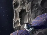 Ilustración de la nave espacial Lucy sobrevolando un asteroide.