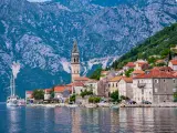Summer trip. Montenegro, view of Bay of Kotor and ancient town of Perast with bell tower of St. Nicholas church Montenegro, Europe. Kotor Bay is a UNESCO World Heritage Site