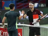 SHANGHAI, CHINA - OCTOBER 12: Grigor Dimitrov (R) of Bulgaria shakes hands with Carlos Alcaraz of Spain after win the Men's Singles Round of 16 match against on Day 10 of the 2023 Shanghai Rolex Masters at Qi Zhong Tennis Centre on October 11, 2023 in Shanghai, China. (Photo by Lintao Zhang/Getty Images)