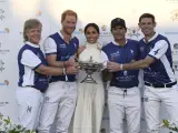 WELLINGTON, FLORIDA - APRIL 12: Dana Barnes, Prince Harry, Duke of Sussex, Meghan, Duchess of Sussex, Adolfo Cambiaso and Malcolm Borwick during the Royal Salute Polo Challenge benefitting Sentebale at Grand Champions Polo Club on April 12, 2024 in Wellington, Florida. The annual Polo Cup has been running since 2010, and to date has raised over £11.4 million to support Sentebale's work with children and young people affected by poverty, inequality and HIV/AIDS in southern Africa. (Photo by Jason Koerner/Getty Images for Sentebale)