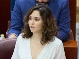 La presidenta de la Comunidad de Madrid, Isabel Díaz Ayuso, interviene durante una sesión de control al Gobierno de la Comunidad de Madrid