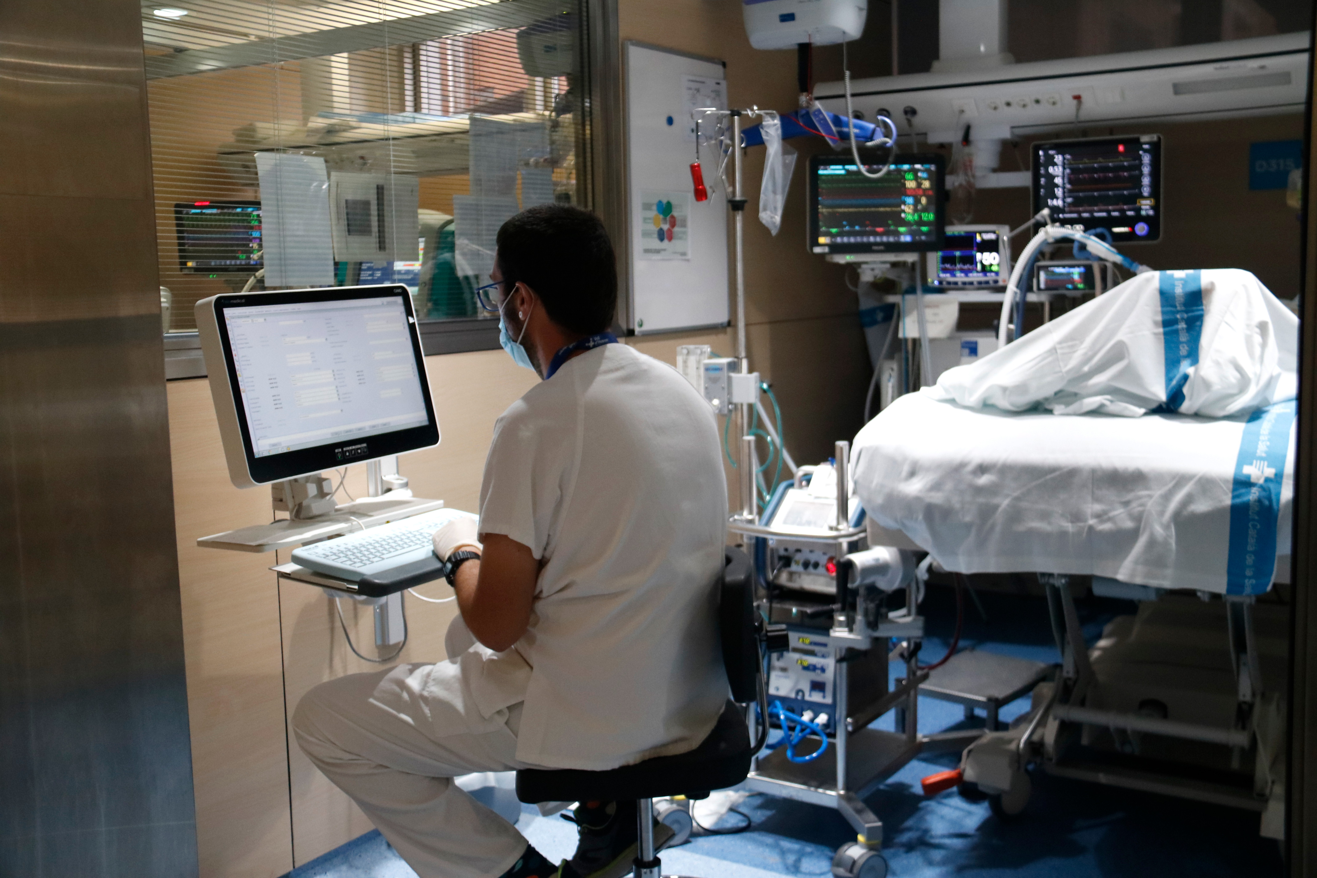 A Worker In The Covid Icu Of Val D'Hebron Hospital In Barcelona.