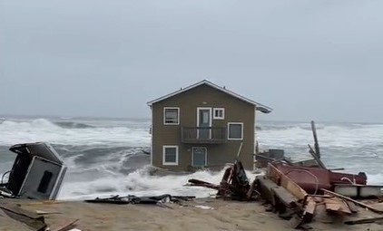 The house collapsed due to the rise in sea level.