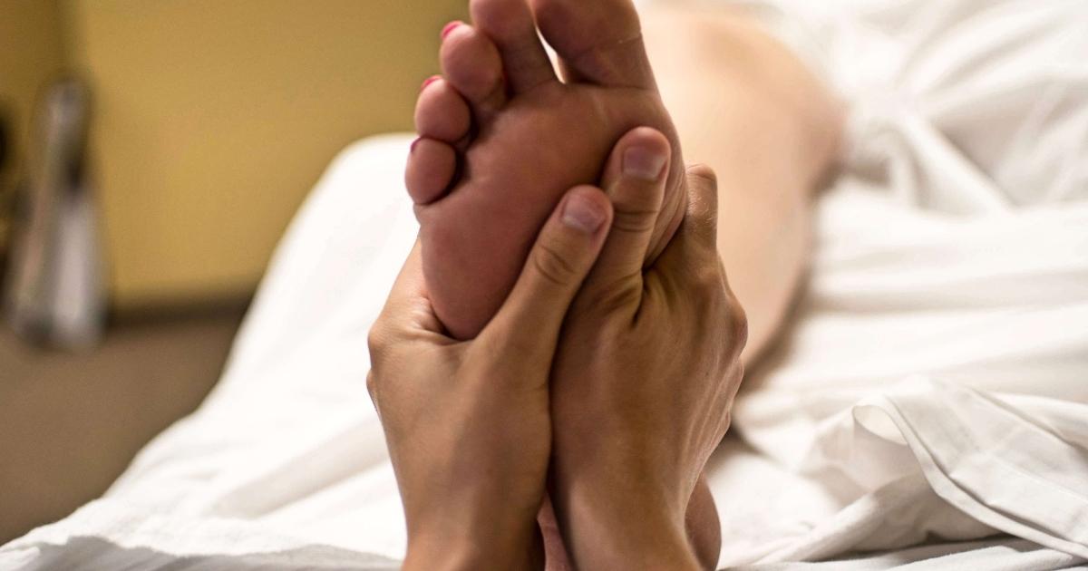A foot receiving a massage.