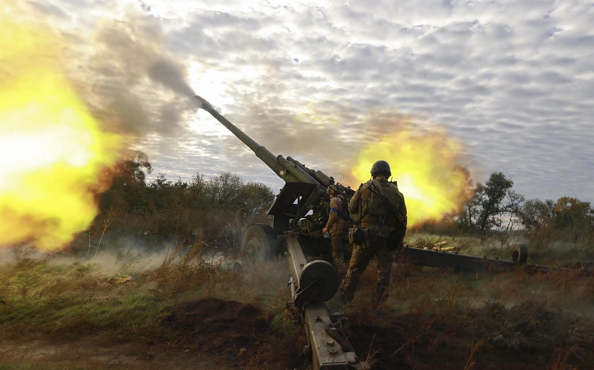 Ukrainian soldiers fire from a captured Russian howitzer in Kharkiv, eastern Ukraine.