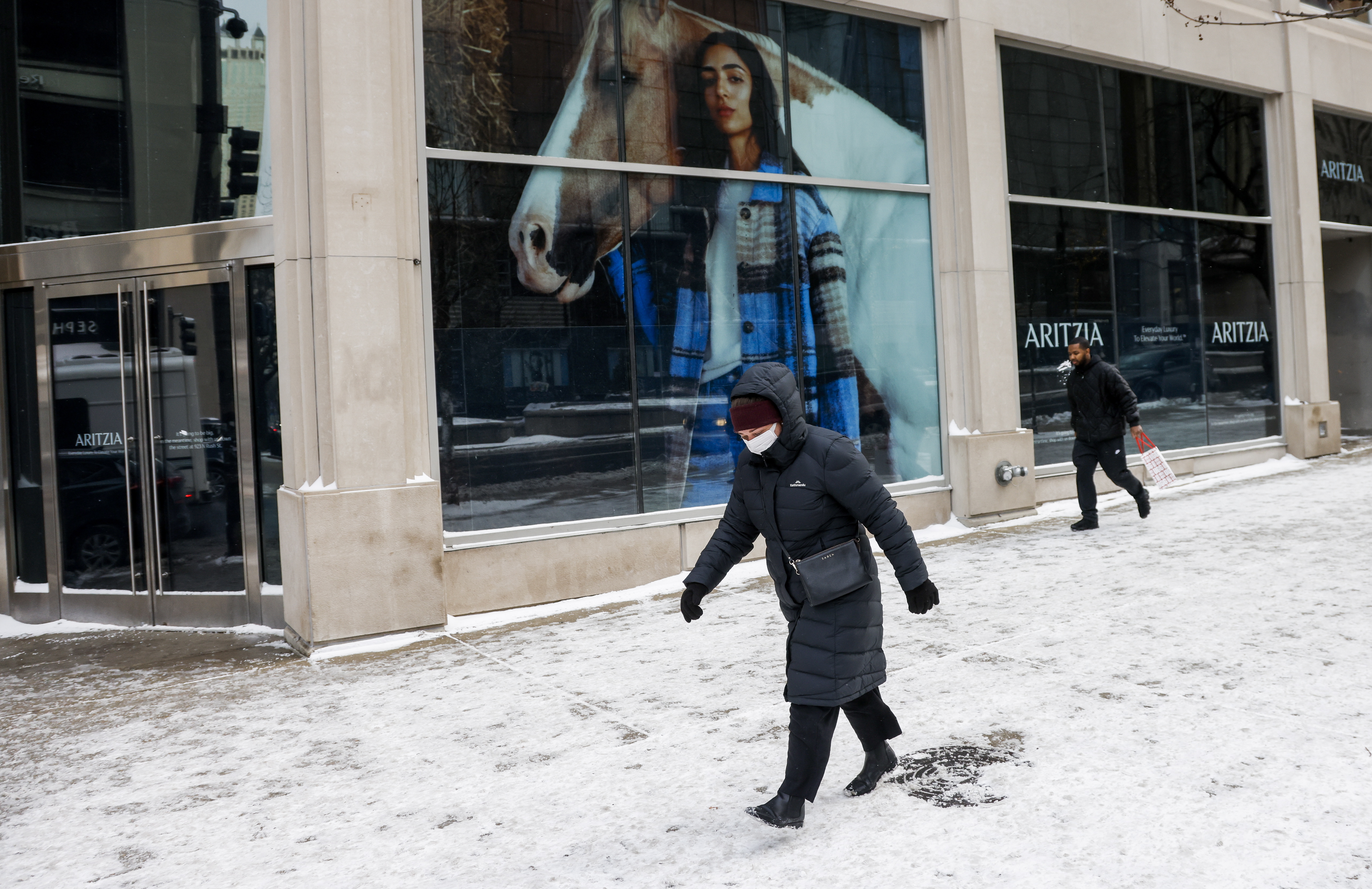 A Woman Tries To Walk In The Cold Winter In America.