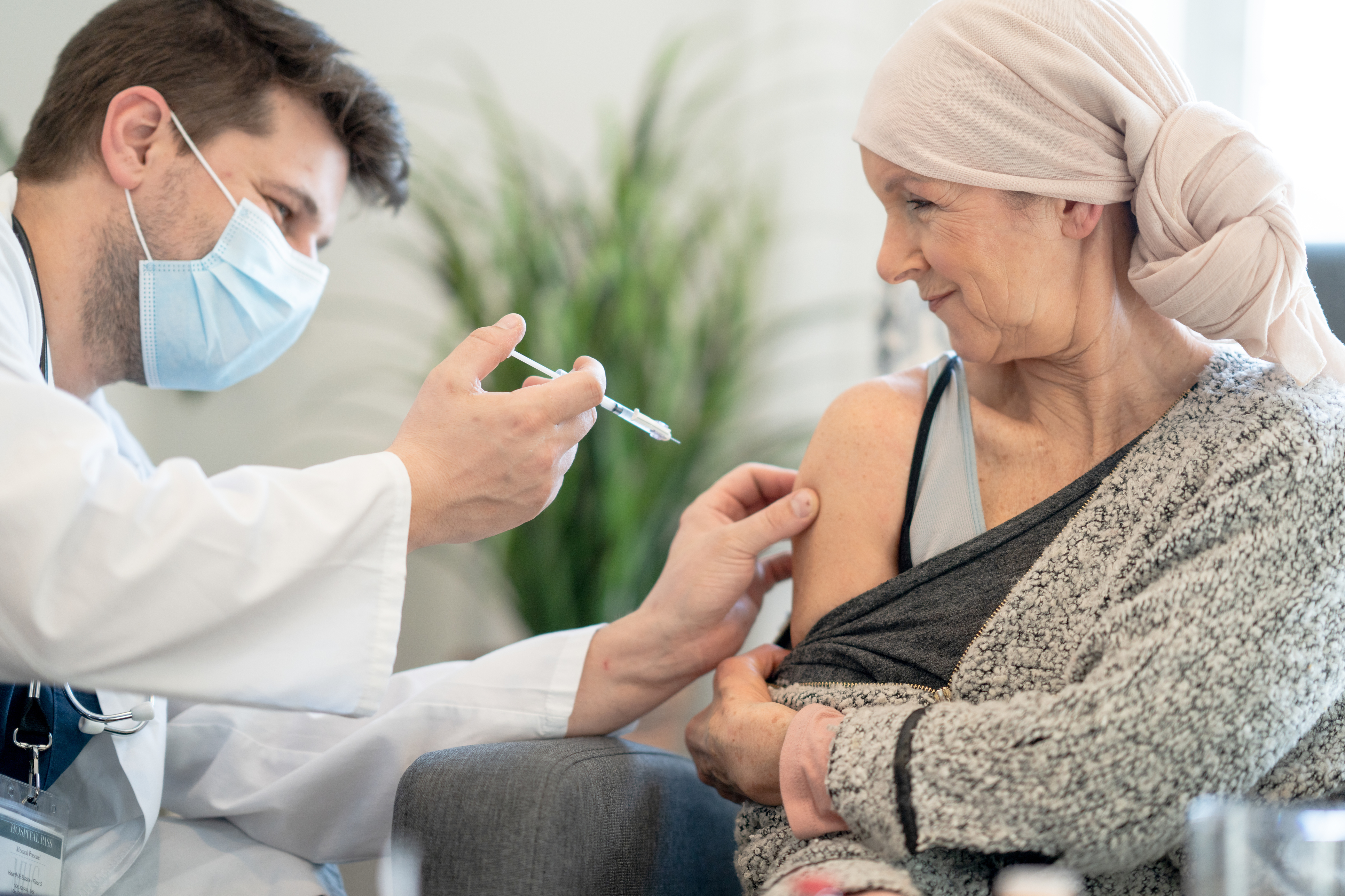 A woman receives a vaccine