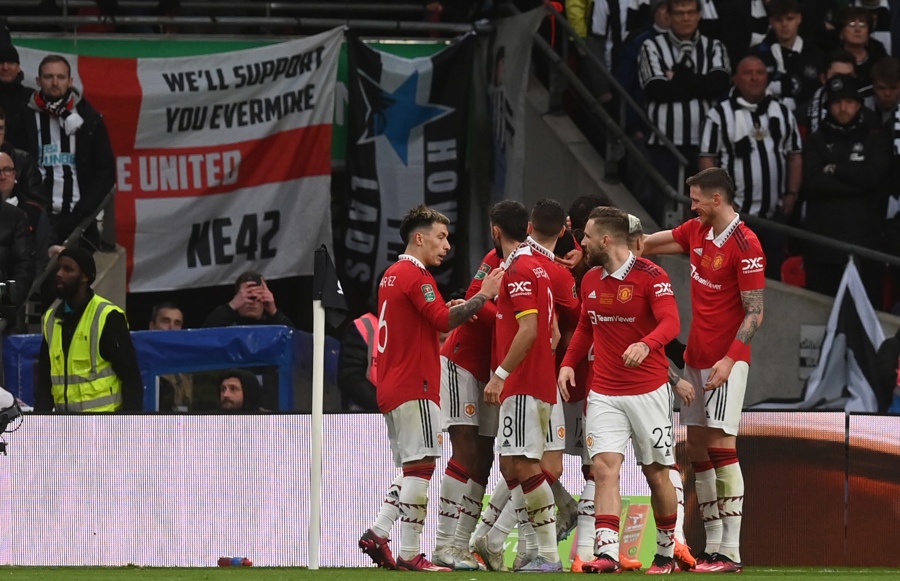 United players celebrate one of the goals.