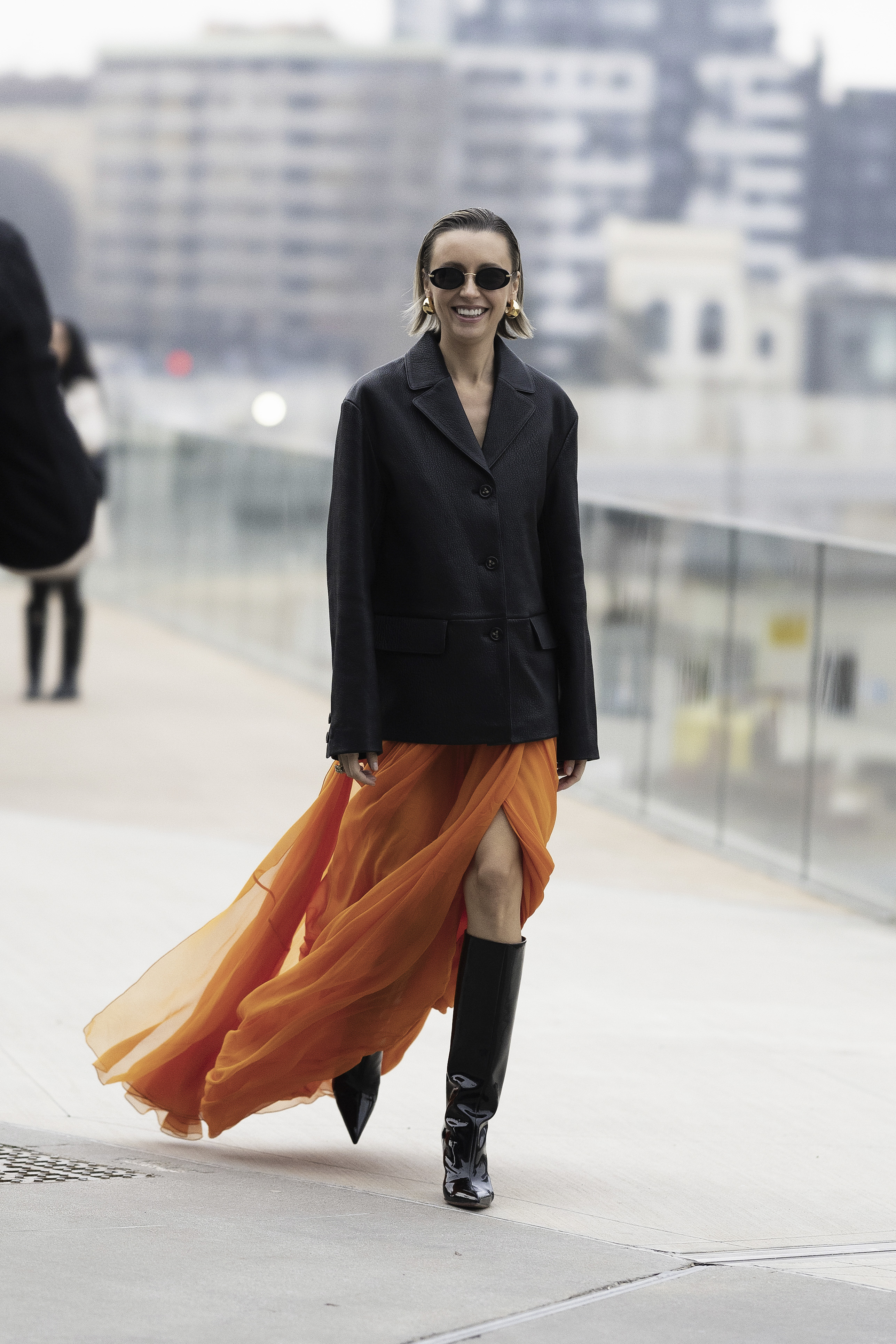 An insider with a blazer and long dress in the 'street-style'.
