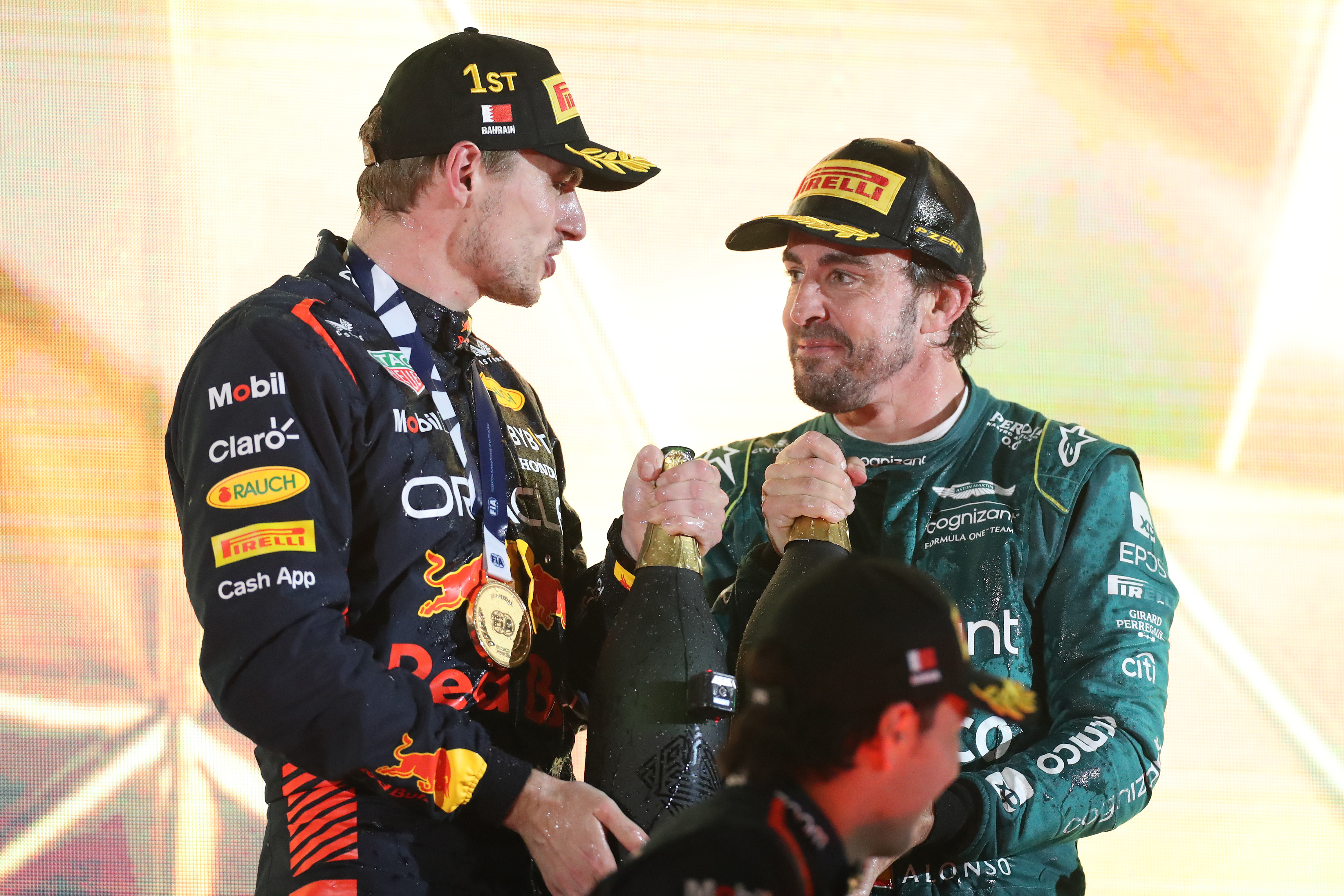 Max Verstappen and Fernando Alonso on the podium in Bahrain.