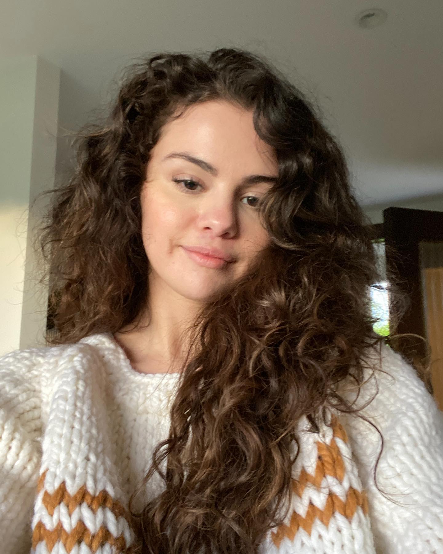 Selena Gomez with her natural curly hair